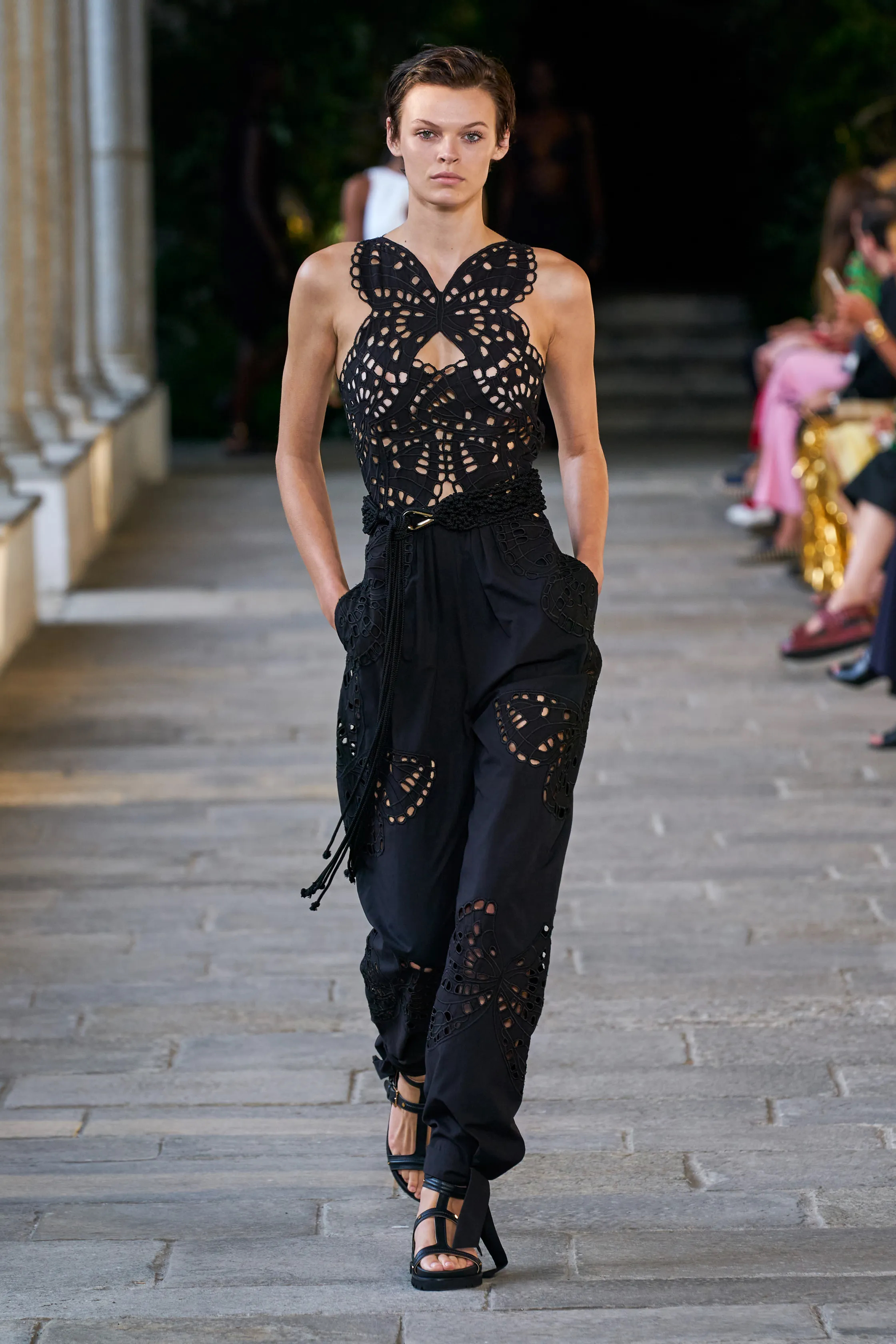 ALBERTA_FERRETI_SPRING SUMMER 2022 MODEL WEARING BLACK SLEEVELESS JUMPSUIT WITH CUTOUT BUTTERFLY PATTERN