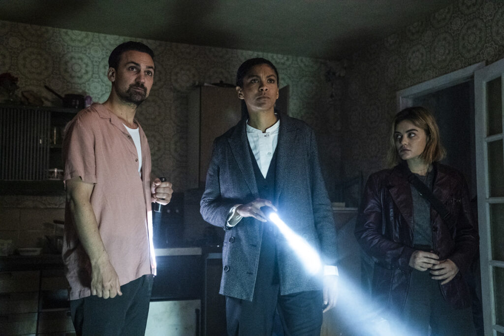 Scene from Ragdoll in dark room with flashlights