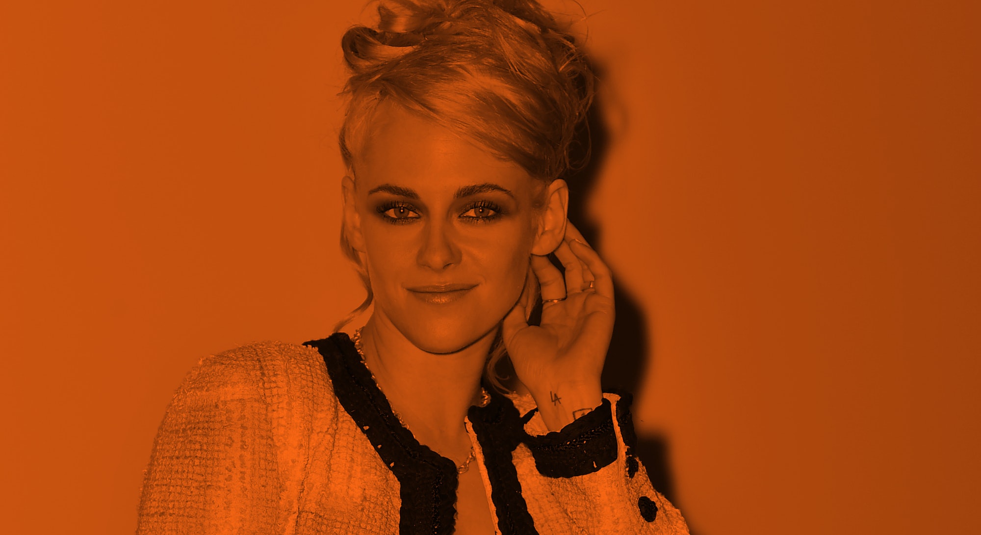 Kristen Stewart image with orange screen wearing Chanel with an Updo
