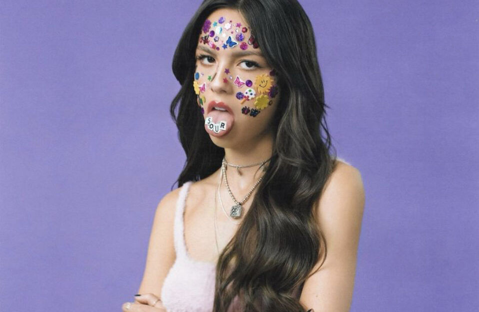 Olivia Rodrigo Sticking her tongue out with Sour spelled on her tongue