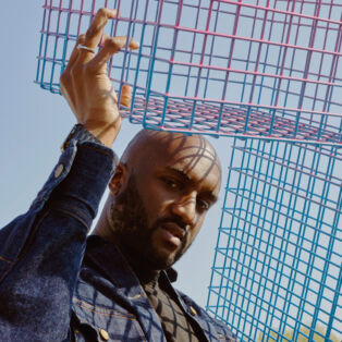 Virgil Abloh Holding Metal Crates