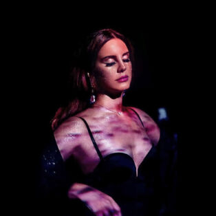 Lana Del Rey Lit With Purple Tint and Shadows