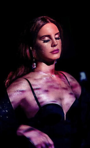 Lana Del Rey Lit With Purple Tint and Shadows