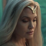 angelina-jolie-as thena in the eternals with blonde hair and gold headband