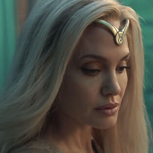 angelina-jolie-as thena in the eternals with blonde hair and gold headband