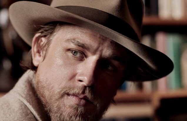 charlie hunnam Wearing a Brown Fedora