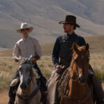 kodi smit-mcphee and benedict cumberbatch on horseback in the power of the dog