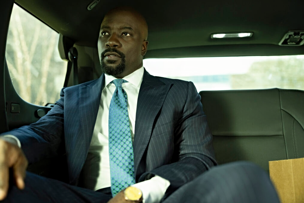 Mike Colter sitting in car