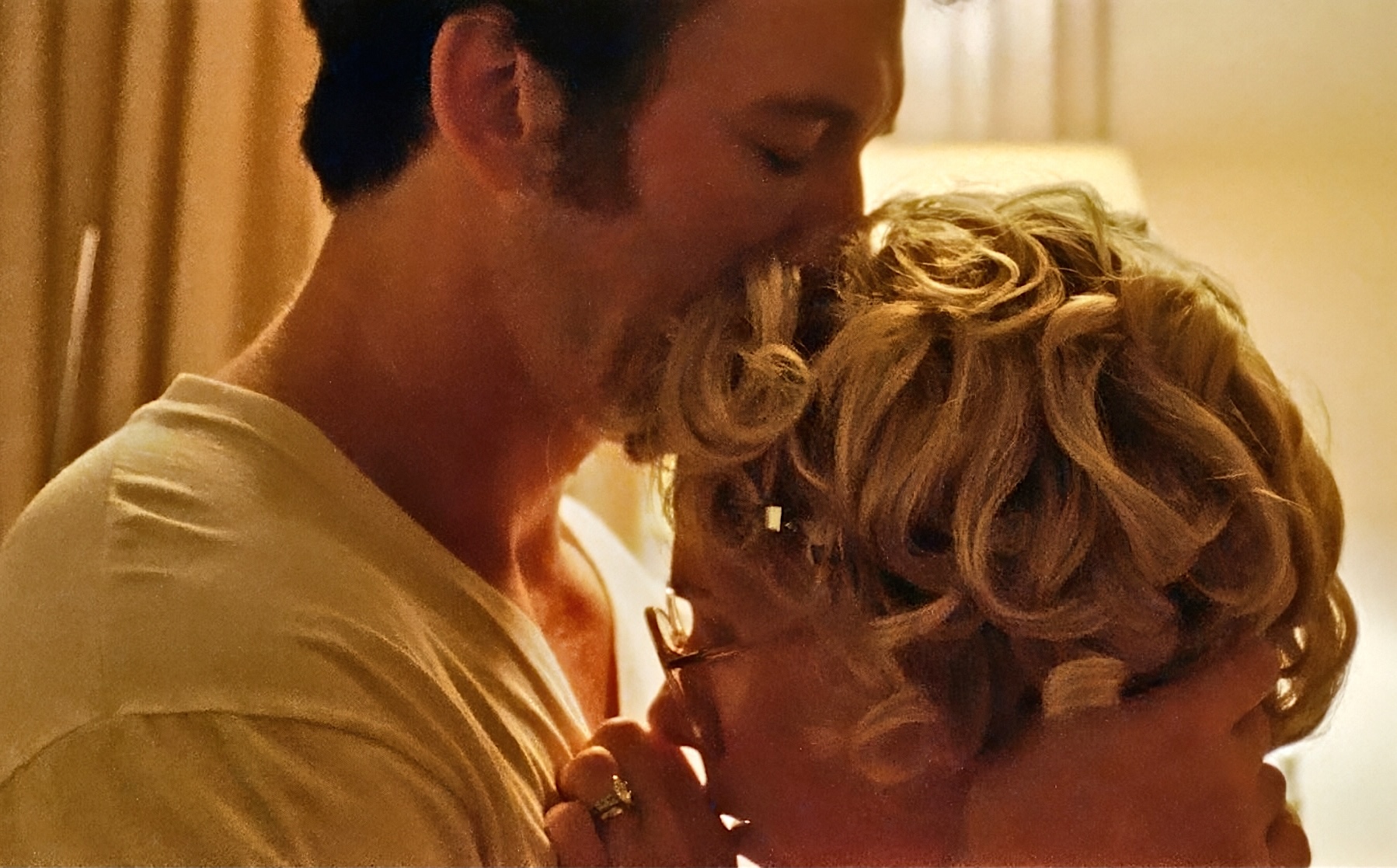 Scarlett Johansson, Miles Teller embracing in Paper Tiger