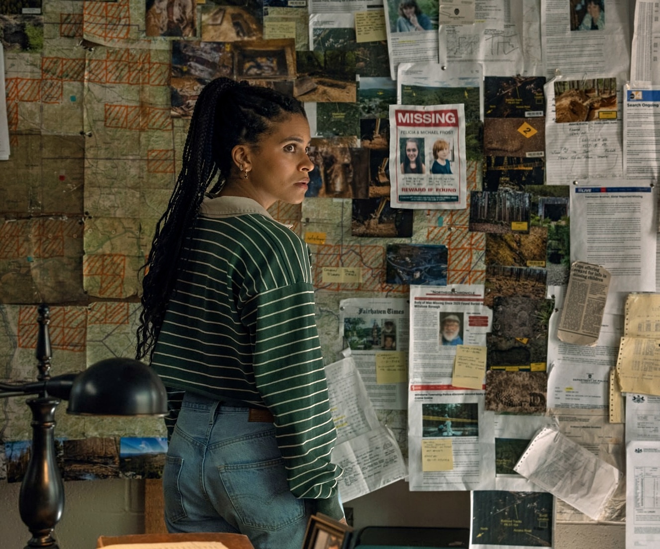 Zazie Beetz standing in front of missing posters