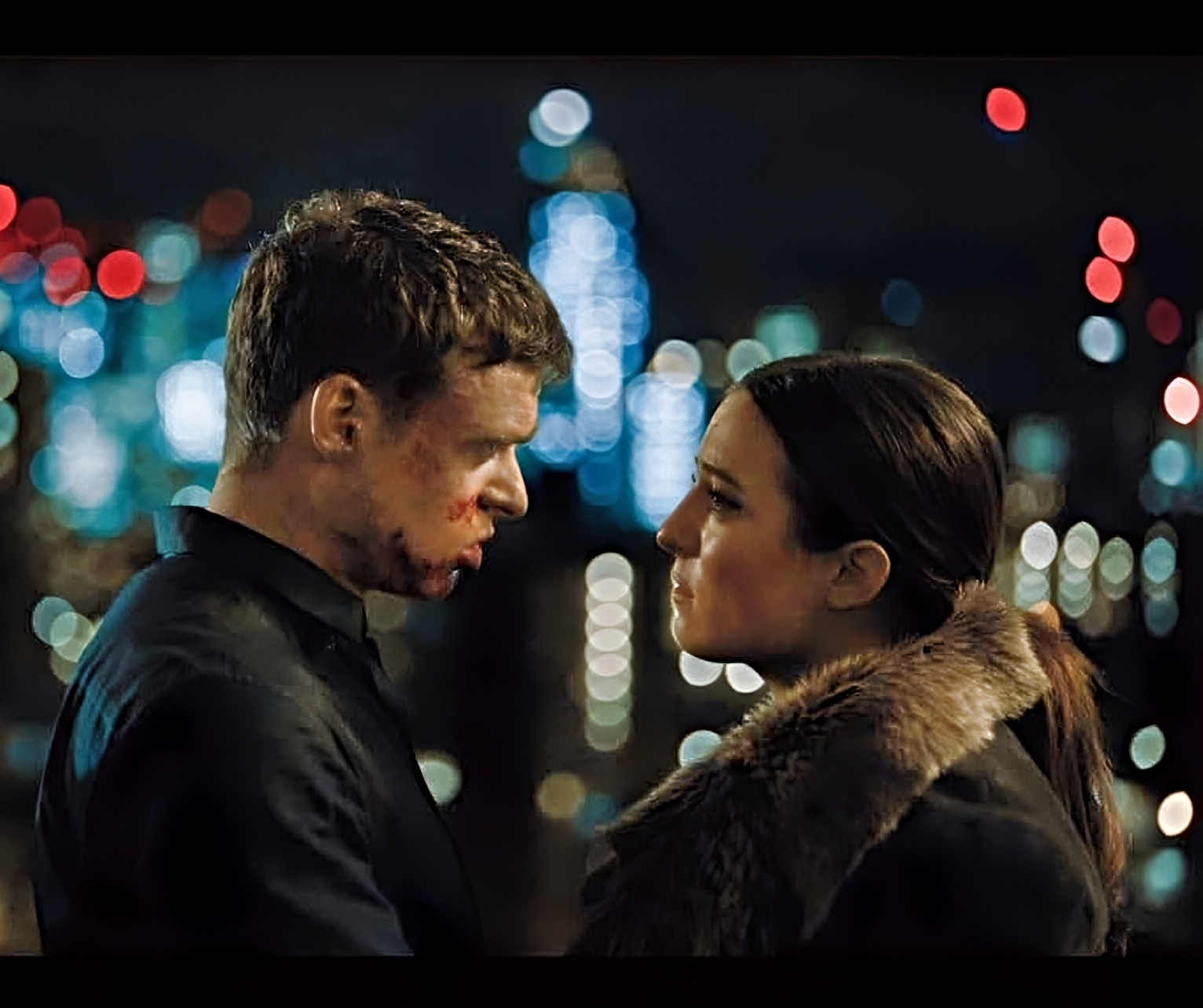 Stephanie Hyam and Richard Madden in Bodyguard, standing in front of city