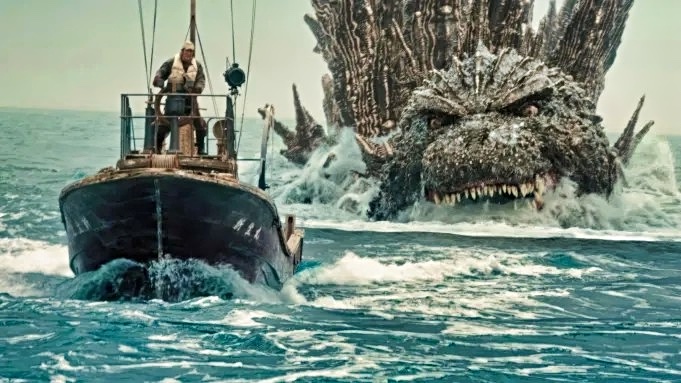Godzilla in water chasing boat