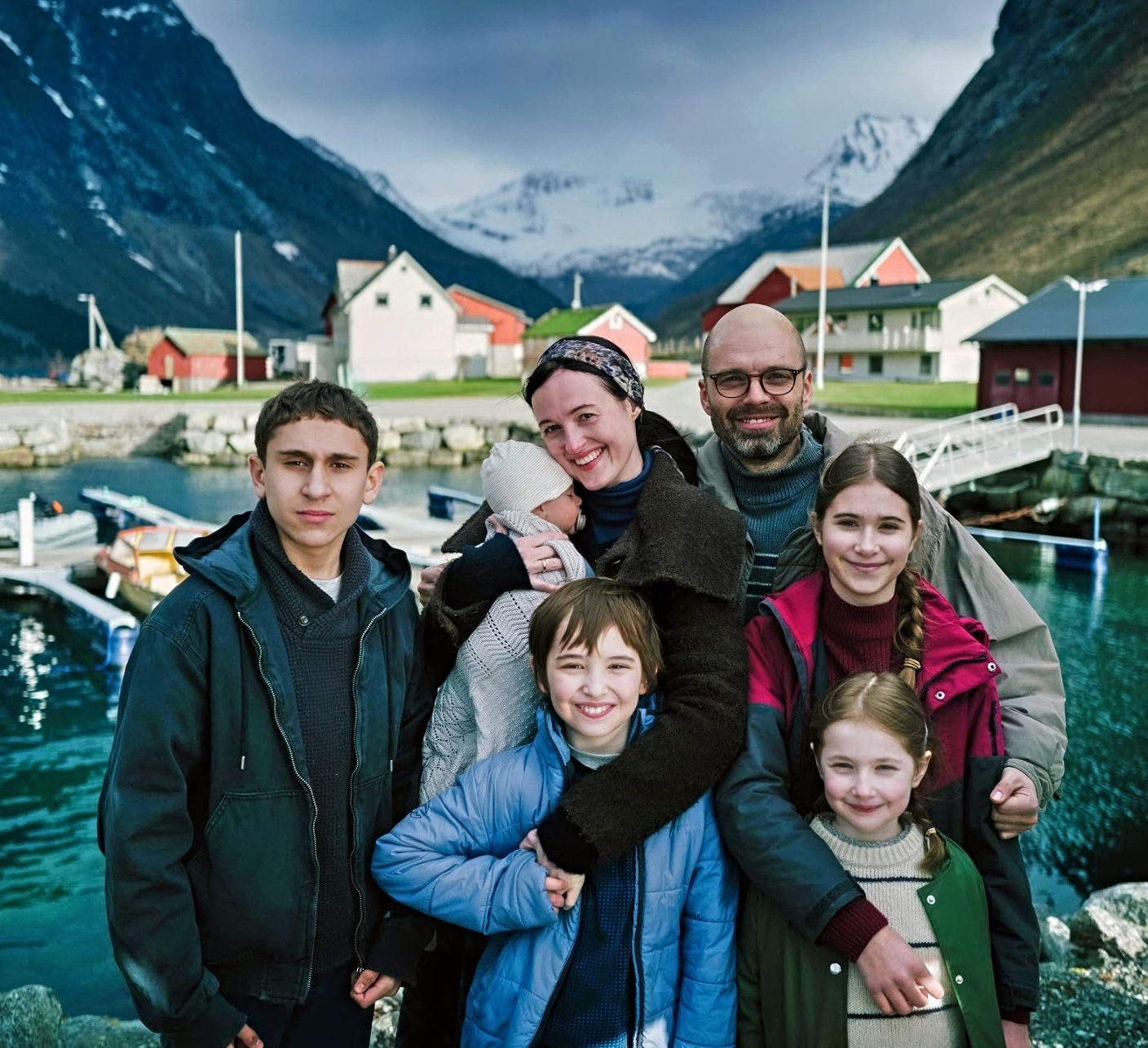 Renate Reinsve, Sebastian Stan standing with family in Fjord