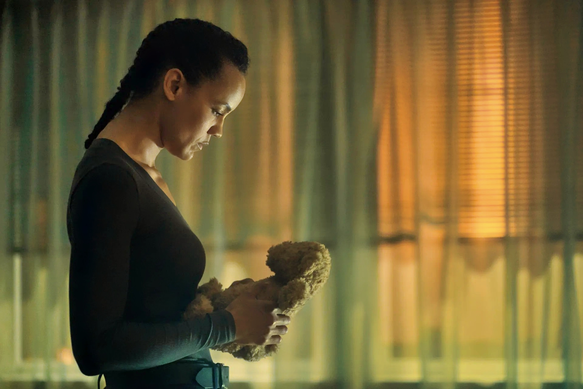 Maria Sten holding teddy bear
