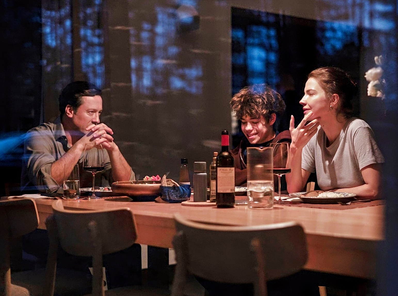family sitting around dinner table in Minotaur