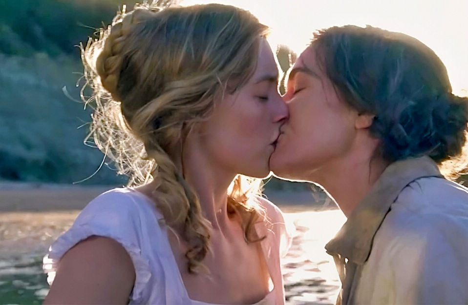 Kate Winslet and Saoirse Ronan kissing in Ammonite