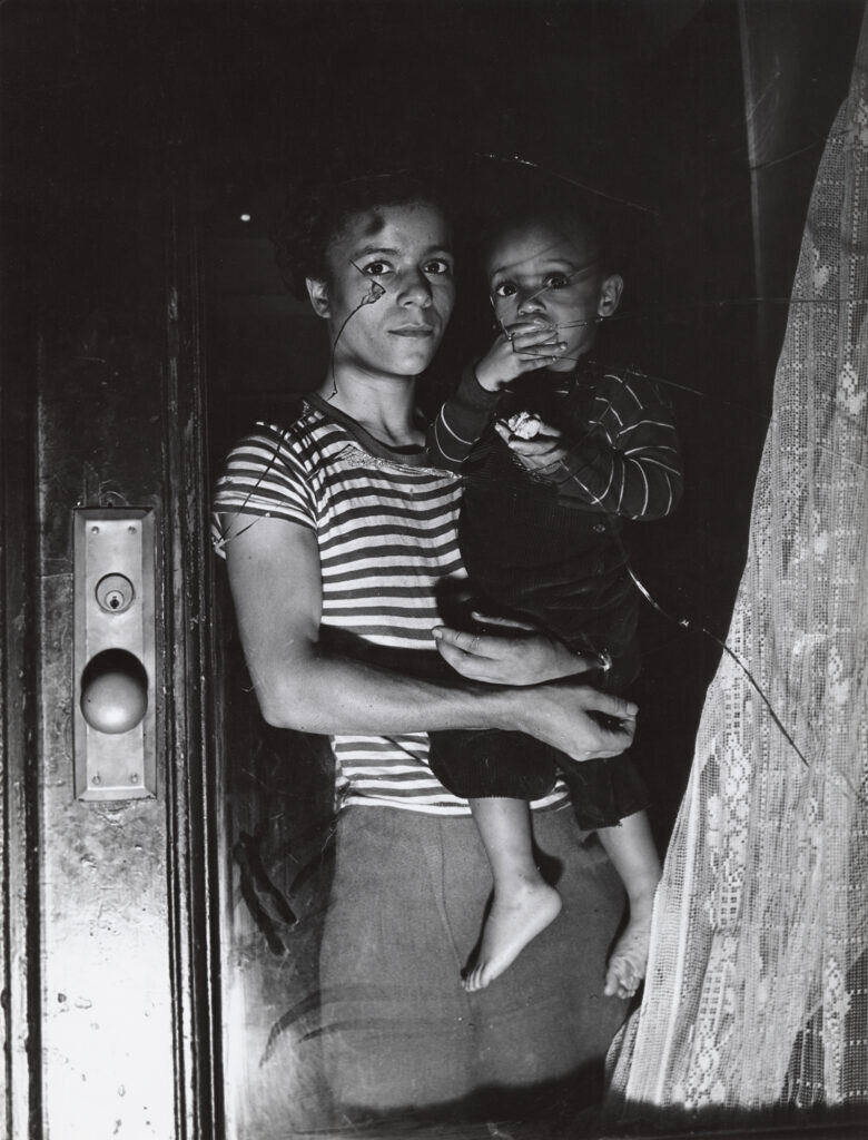 Weegee, Ms. Bernice Lythcott and son, Harlem, New York, 1943. Courtesy of ICP_Getty Images
