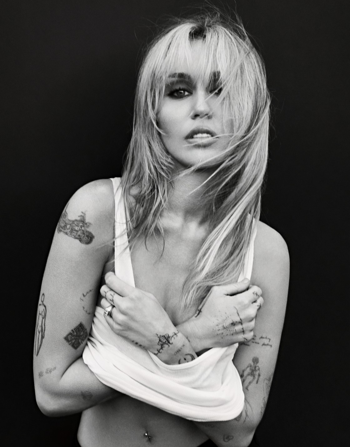 Miley Cyrus in a white tank top